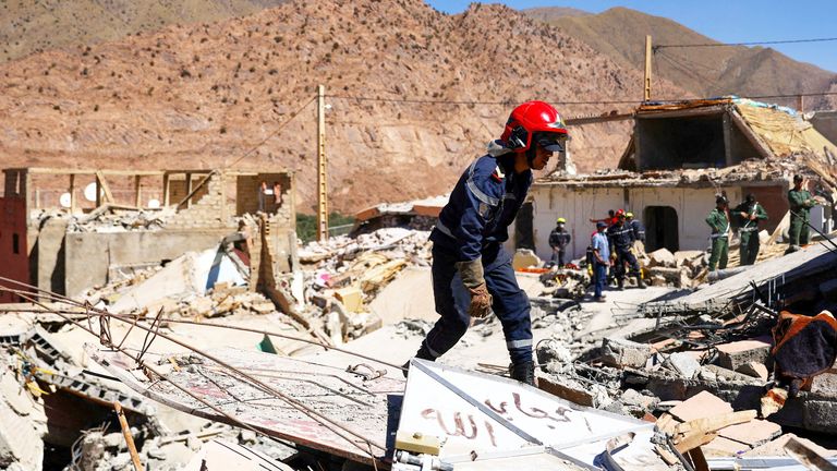 A search worker stands among rubble in the aftermath of a deadly earthquake in Talat N'yaaqoub, Morocco, September 11, 2023 