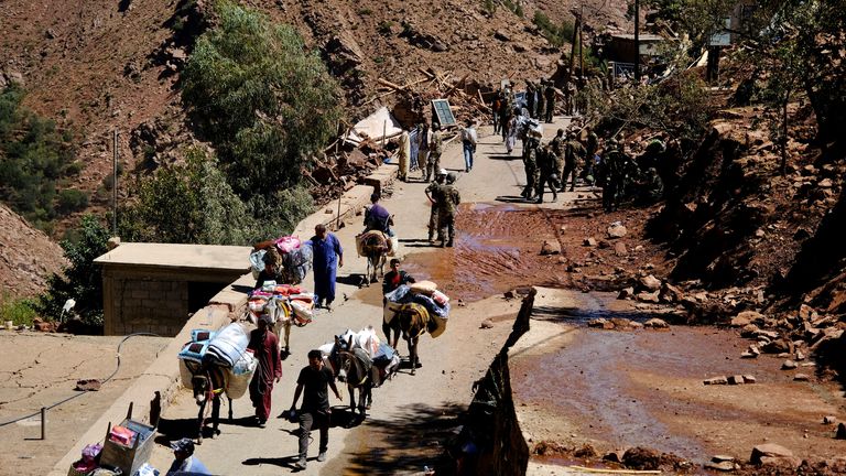 Survivors transport emergency supplies