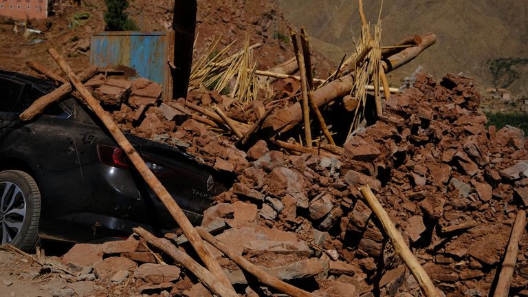 A car buried under rubble