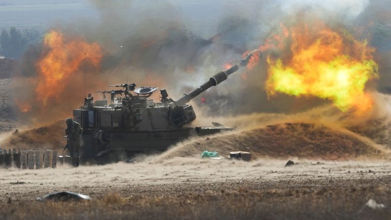 An Israeli mobile artillery unit fired a shell from southern Israel towards the Gaza Strip. Pic: AP