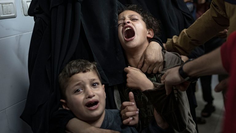 Palestinians mourn their relatives killed in the Israeli bombardment of the Gaza Strip, in the hospital in Khan Younis. Pic: AP